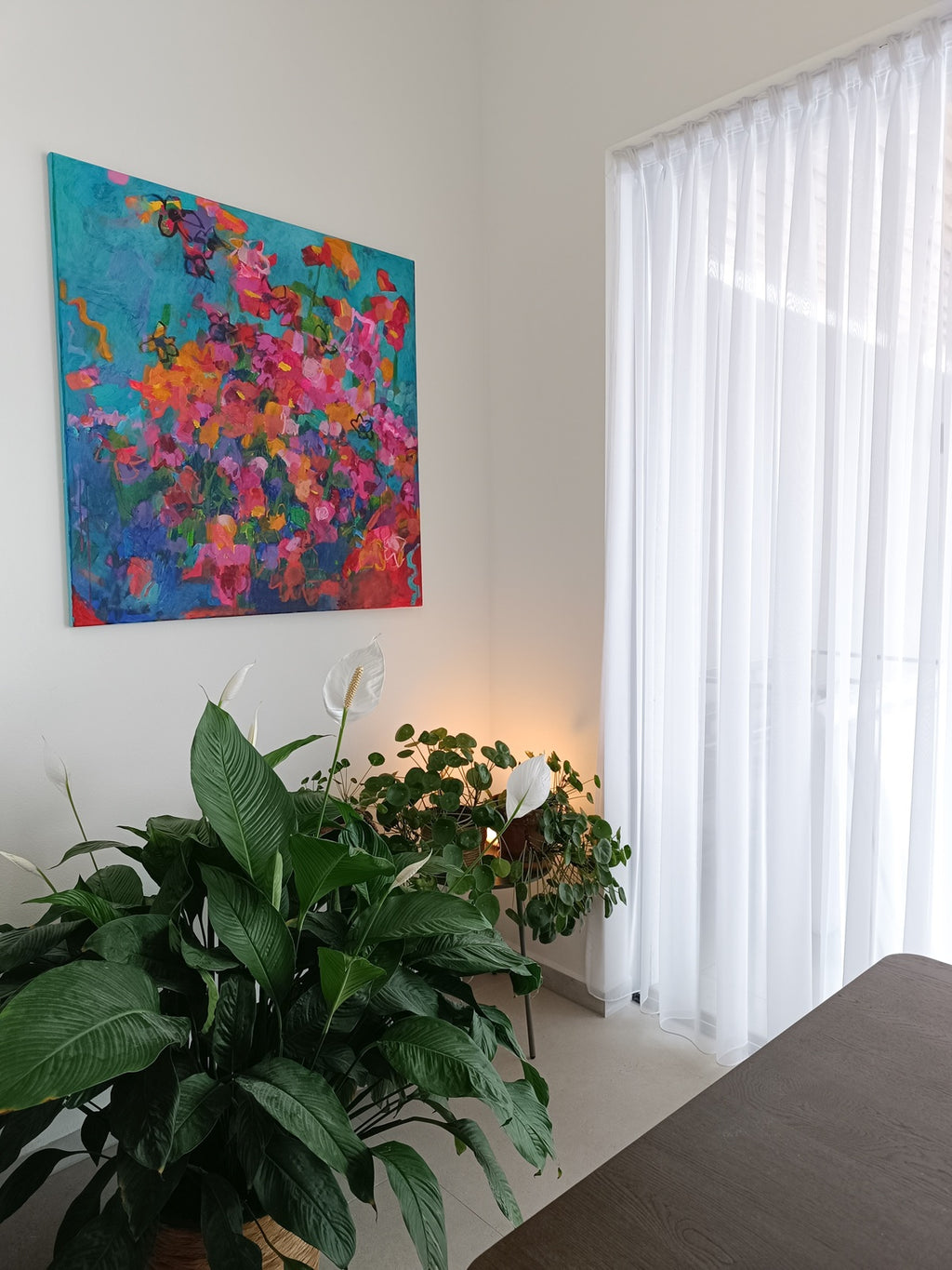 Abstract floral artwork in modern interior with designer furniture
