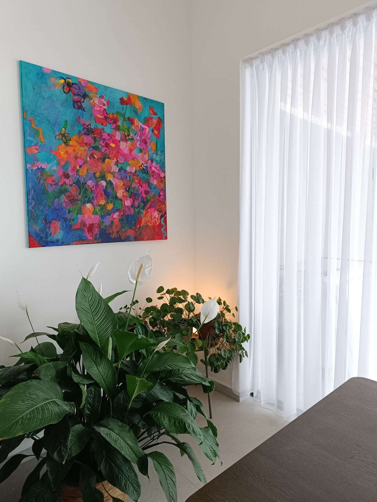 Abstract floral artwork in modern interior with designer furniture
