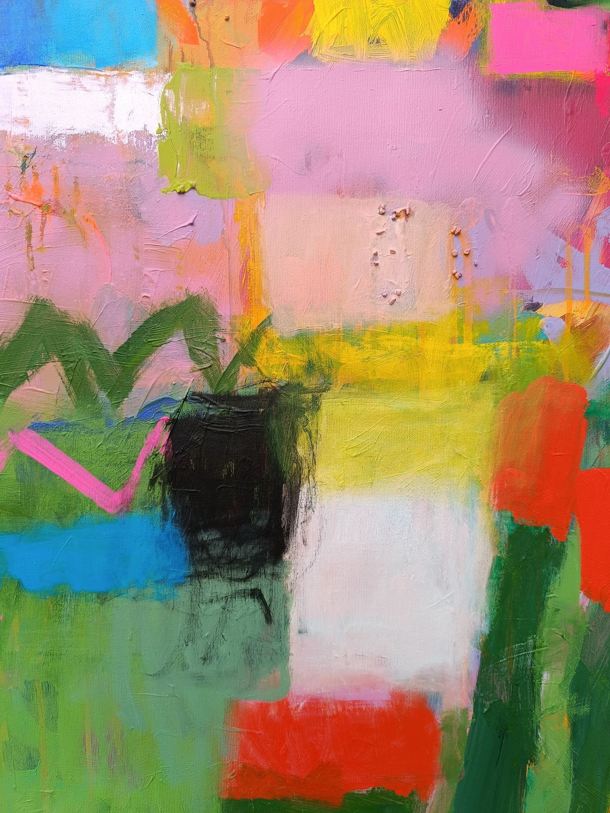 Close-up of red accents in colorful abstract painting with textured surface