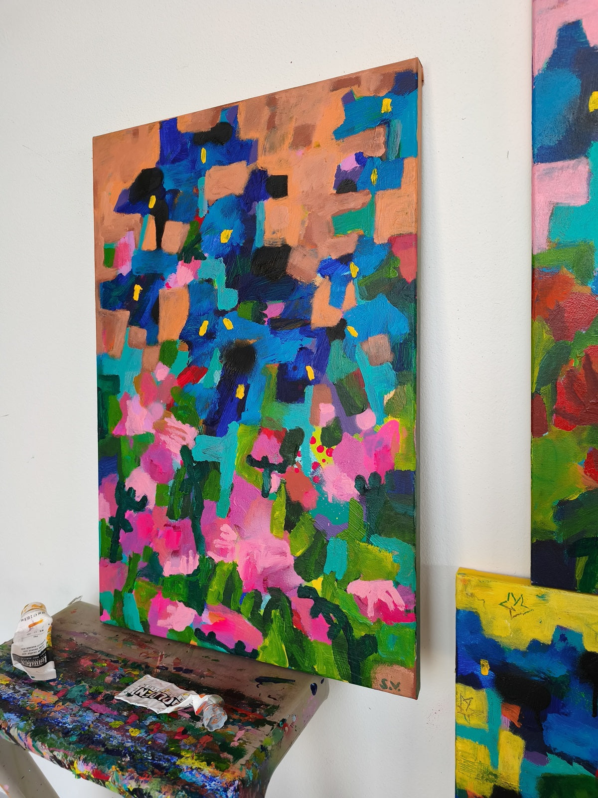 Modern small canvas wall art with abstract floral composition in orange, blue and pink tones