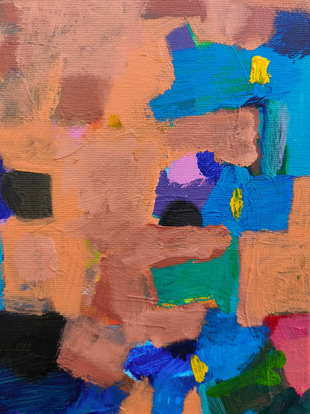 Close-up of small canvas art showing rich texture, pink floral accents and layered paint