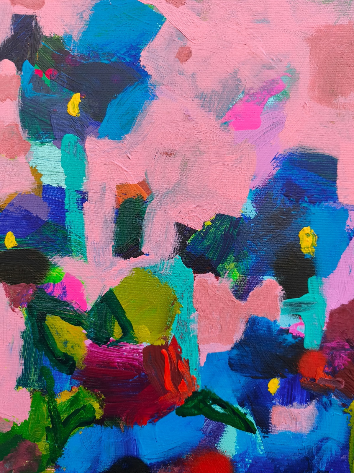 Close-up of small canvas art showing rich texture and layered brushwork in abstract floral composition