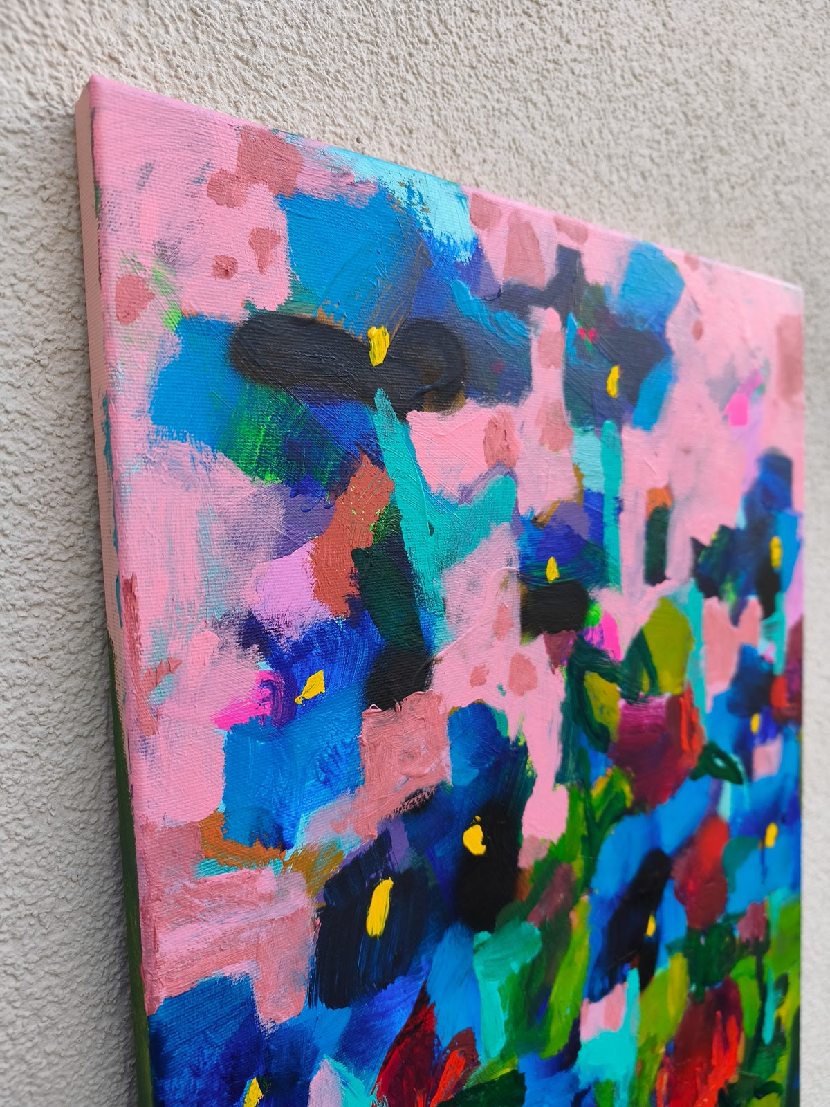 Abstract floral canvas art in home interior, small painting adding color and texture to modern space