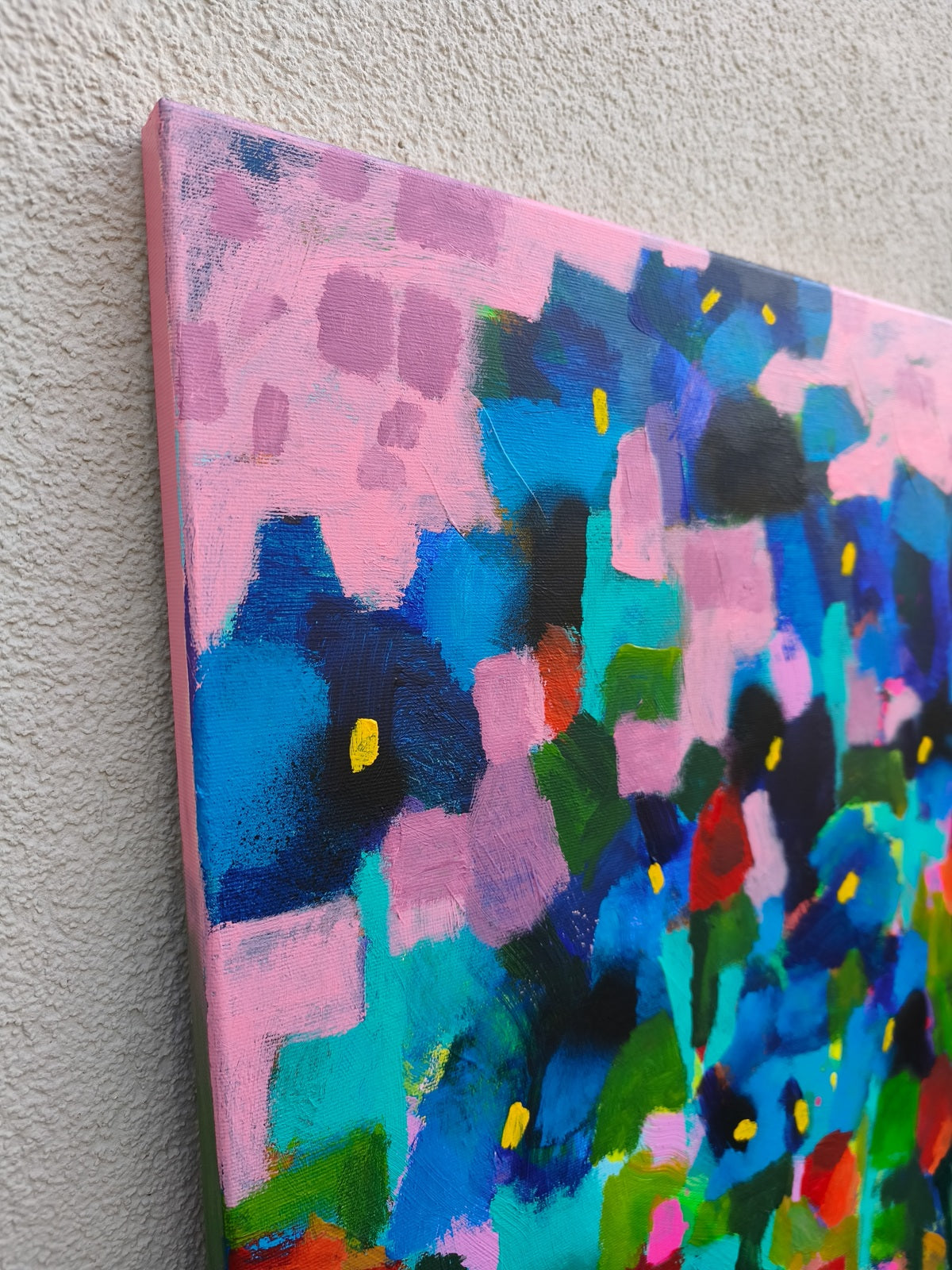 Abstract iris flower detail in ultramarine blue with soft pink sky and visible texture