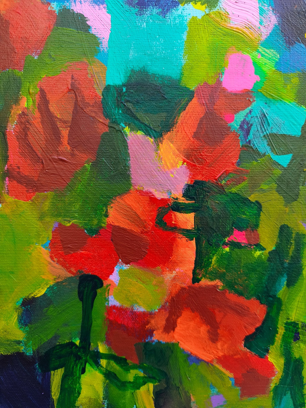 Close-up of small canvas art showing rich texture, red floral elements and layered paint